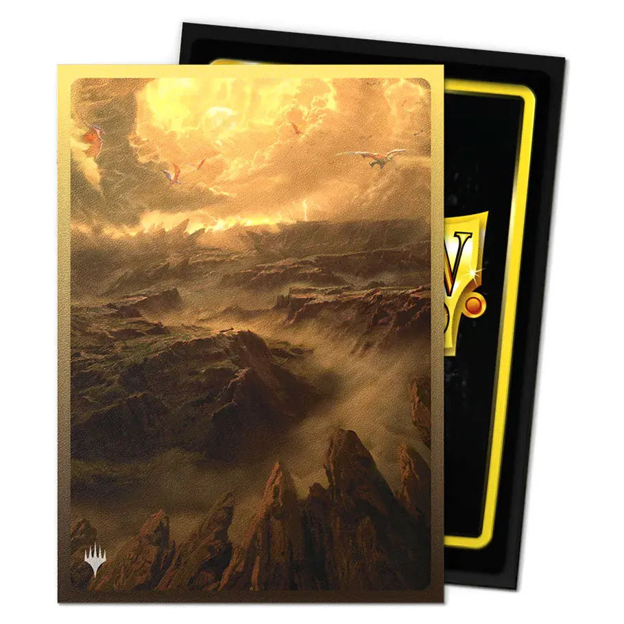 Dragon Shield Sleeve with mountain landscape design in a black and yellow box