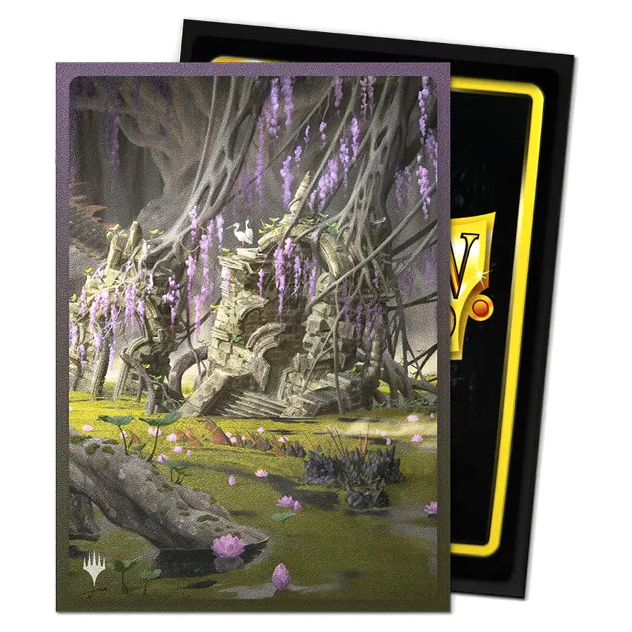 Dragon Shield Sleeve with a Fantasy landscape with ruins and purple flowers in a card packaging